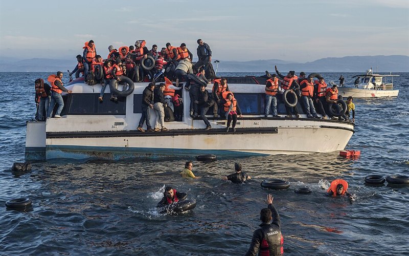 A crowded migrant boat at sea