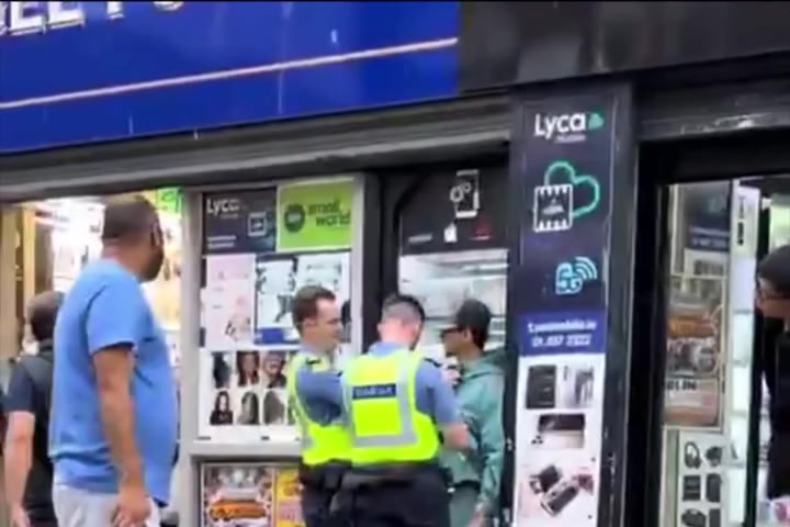 Gardaí stop a man on Moore Street in daylight